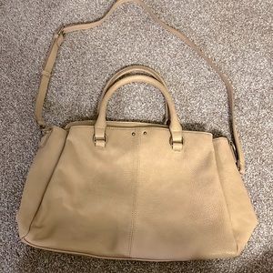 Market and spruce purse in tan color.